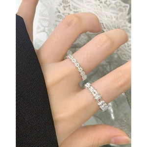 Elegant S925 sterling silver flower and woven rings worn together on hand