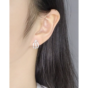 S925 sterling silver earrings with irregular liquid metal texture worn by a model