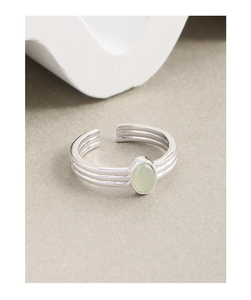 Detailed shot of S925 silver ring with triple-band design and green oval crystal