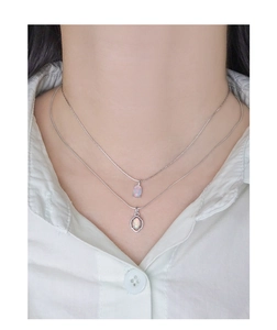 Close-up of double-layer S925 silver necklace set featuring elegant oval opal pendants