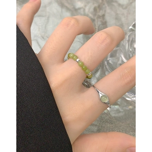 S925 sterling silver ring set with green crystal beads and oval gemstone on hand