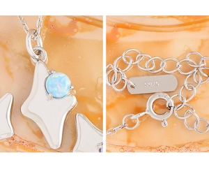 Macro detail of S925 sterling silver chain with spring clasp and star opal pendant