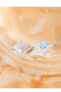 Macro detail of S925 sterling silver star stud earrings with blue opal and hallmark