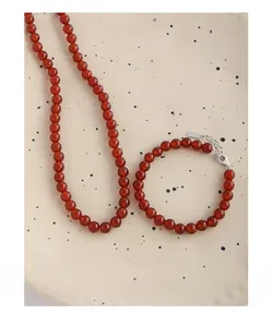 Detail of red agate beaded necklace and bracelet set with S925 sterling silver clasps