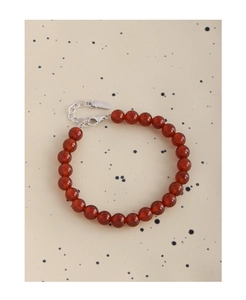 Close-up of S925 sterling silver clasp and polished red agate beads on a beaded bracelet
