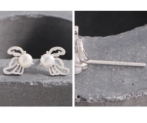 Macro detail of S925 sterling silver hallmark on hollow wing pearl stud earrings