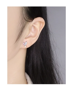 Detailed view of S925 silver stud earrings with marquise crystals and tiny white pearls
