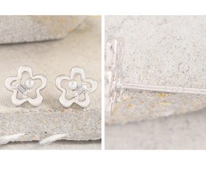 Detail of S925 sterling silver stamp on floral earrings with pearl and zircon