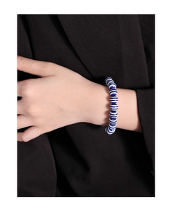 Detailed view of S925 silver beaded bracelet with navy blue and white striped round beads