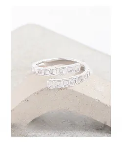 Macro detail of S925 sterling silver ring with textured fish scale spiral design