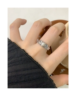 Detailed view of an S925 silver ring featuring a white pearl and irregular wrinkled texture