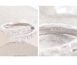 Macro shot of S925 sterling silver ring with fish scale texture and small zircon detail