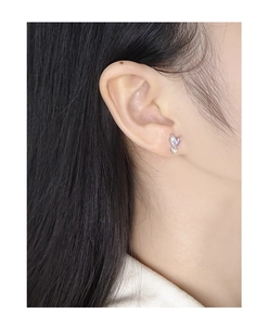 Detailed shot of S925 silver earring with heart-shaped purple zircon and mini pearl