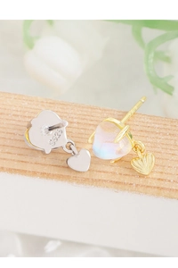 Macro shot of S925 sterling silver stamp on heart moonstone earrings with gold finish