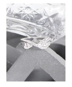 Macro shot of S925 sterling silver ring with molten lava texture on stone display