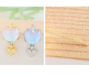 Macro detail of S925 sterling silver hallmark and moonstone heart earrings set