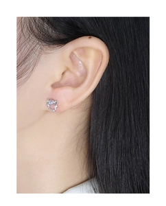 Close-up of S925 silver moonstone star earring worn on model for a dainty look