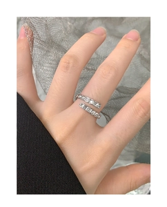 Close-up of S925 sterling silver wrap ring with shimmering fish scale pattern cubic zirconia