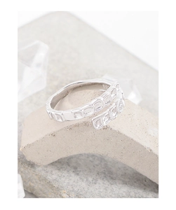 Detail of S925 sterling silver ring showing hallmark and rectangular zircon inlays