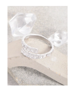 Detail of S925 sterling silver ring featuring fish scale texture and cubic zirconia stone