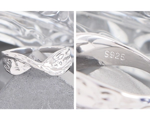 Macro detail of S925 sterling silver ring showing hammered texture and hallmark