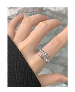 Detail of S925 silver wrap ring with rectangular baguette cubic zirconia stones