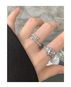 Close-up of S925 sterling silver heart ring and pavé crystal wrap ring set for women