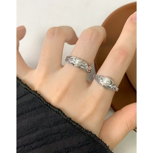 S925 sterling silver textured rings with white pearls in a set of two shown on hand