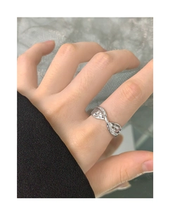 Detail view of S925 sterling silver ring featuring unique irregular molten texture