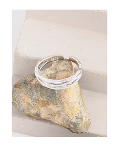 Macro shot of S925 sterling silver ring showing the inner stamp and wavy texture