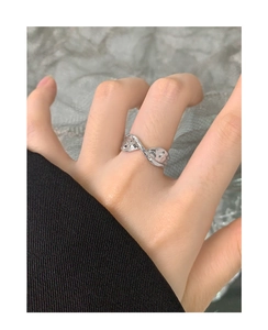 Detail of S925 sterling silver ring with unique pleated texture on model finger