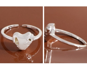 Detailed macro view of S925 sterling silver heart ring with molten texture and zircon inlay