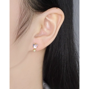 Elegant S925 silver heart moonstone earrings with gold plating on a female model