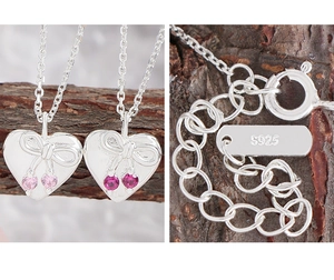 Close-up of S925 sterling silver bow heart necklace with pink zircon and hallmark detail