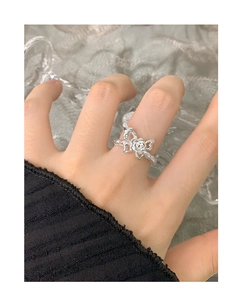Detail of S925 silver ring featuring a rose flower and butterfly wings texture