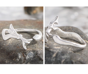 Macro shot of S925 sterling silver bow ring showing Hallmark engraving on inner band