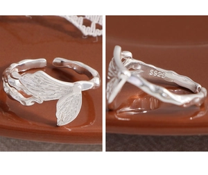 Detailed macro view of S925 sterling silver mermaid tail ring with scaly texture finish