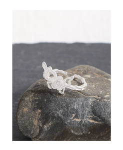 Detail of adjustable S925 silver ring featuring a floral rose and butterfly texture