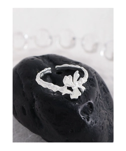 Macro shot of S925 sterling silver bow ring with irregular texture and hallmark
