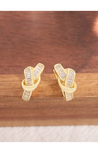 Macro view of gold knotted hoop earrings with rectangle-cut zircon stones