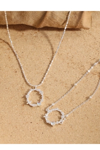 Detail of S925 silver necklaces featuring moonstone pendants and natural leaf accents