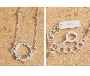 Close-up of S925 sterling silver butterfly flower necklace with moonstone and clasp detail
