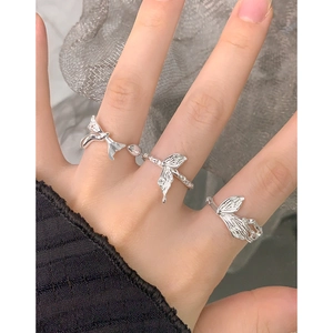 Handcrafted S925 silver irregular bow rings with antique texture on model's hand