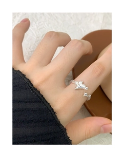 Detail shot of a S925 sterling silver heart and star irregular open ring on a finger