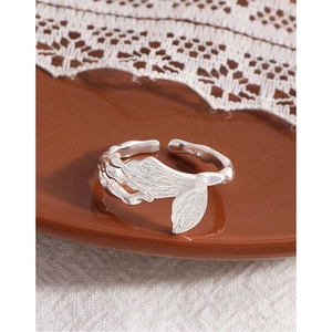 Elegant S925 silver butterfly wing open ring with fine pleated texture on ceramic tray