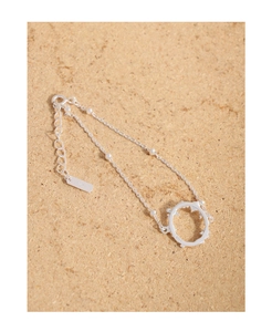 Detail of S925 sterling silver bracelet with white pearls and openwork circle charm