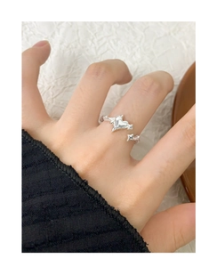 Detailed view of S925 sterling silver open ring with cross star and heart design