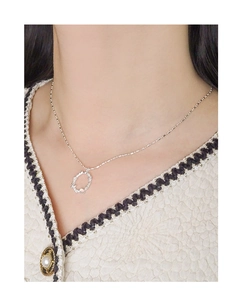 Close-up of S925 silver necklace with butterfly flower wreath and moonstone pendant