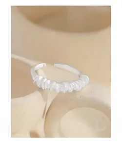 Close-up of S925 sterling silver ring featuring an irregular layered fold design