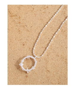 Detailed close-up of S925 sterling silver stamp on butterfly flower moonstone necklace